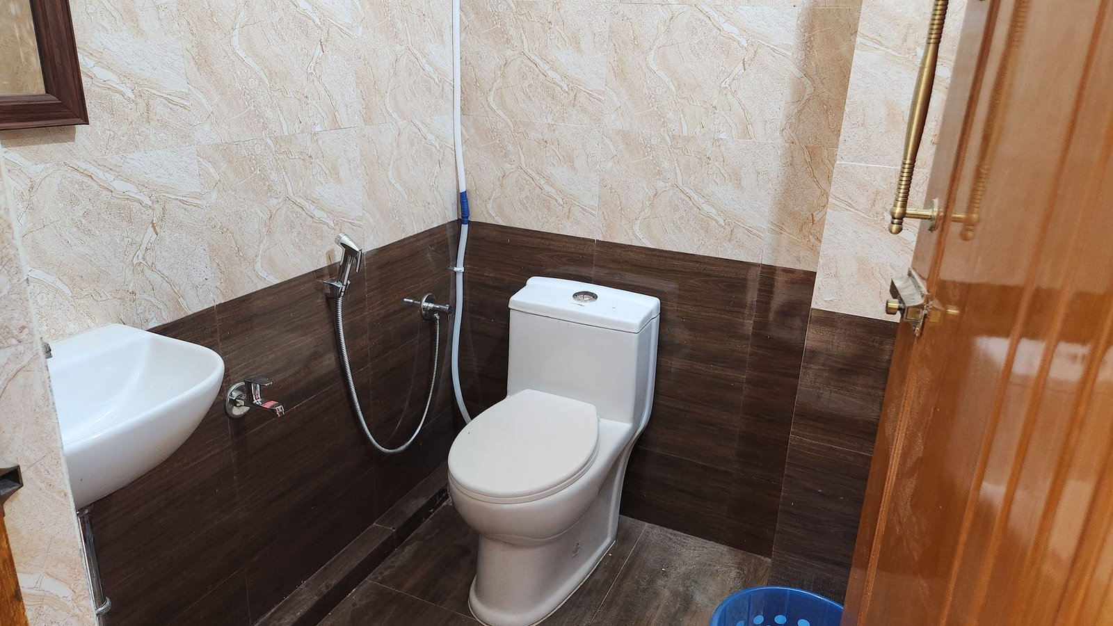 Clean attached bathroom with Western WC at Vishaka INN